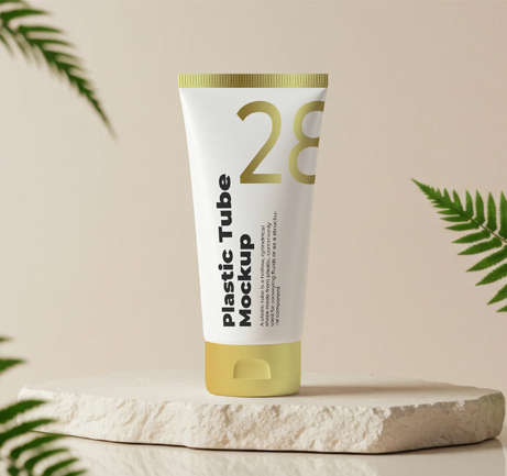 Free plastic tube mockup on stone base with fern leaves