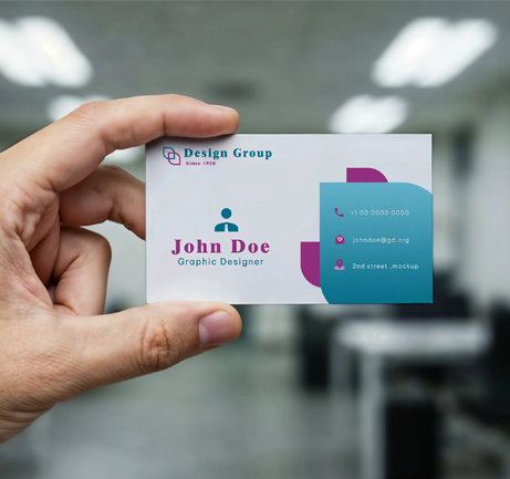 Free business card held in hand mockup in office scene